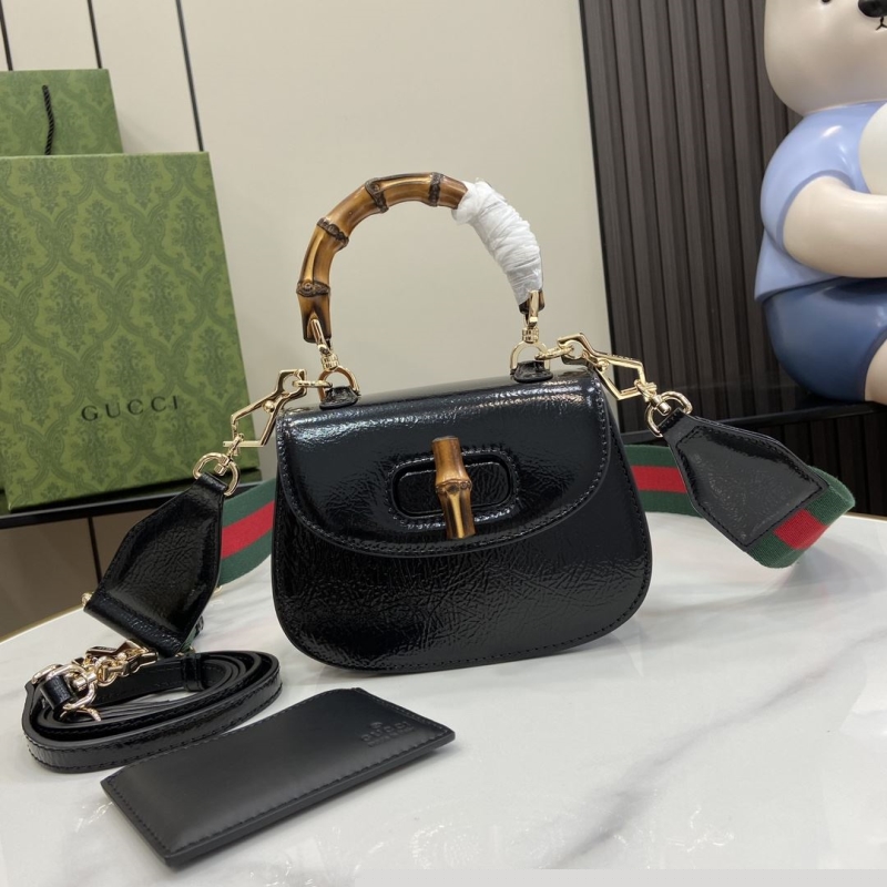 G*u*i top handle bags